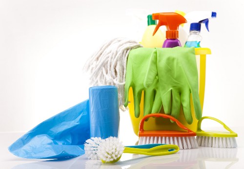 Technician removing dirt and stains during upholstery cleaning
