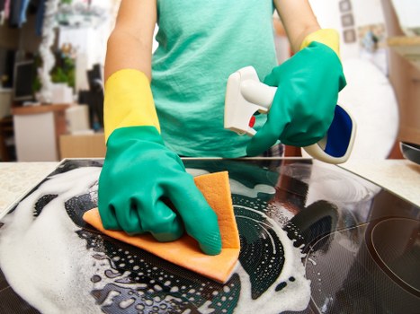 Deep cleaning a cushioned chair with professional upholstery equipment
